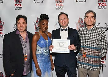 Arek Zasowski with an actress Aemy Niafeliz, and with Jon Grusha and Peter Greene, the Golden State Film Festival Organisers at the festival awards ceremony at the TCL Chinese Theatre in Hollywood