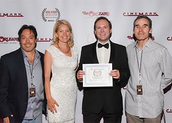 Arek Zasowski with Viola Zasowska, Jon Grusha and Peter Greene, the Silver State Film Festival Organisers at the festival awards ceremony in Las Vegas, NV