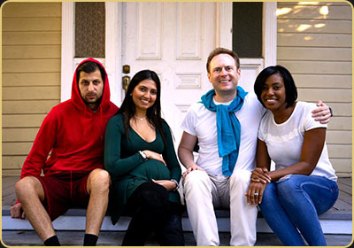 Arek Zasowski seated with three fellow actors on the steps of a house set at Universal Studios Hollywood during the filming of Life Is Beautiful, a short film created during a NYFA acting workshop in October 2018