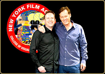 Arek Zasowski smiling alongside director Bruce MacWilliams in front of the New York Film Academy emblem during his Acting for Film training in Los Angeles, October 2018