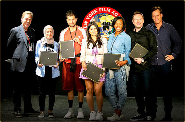 Arek Zasowski holding certificate at the New York Film Academy screening ceremony in Los Angeles, surrounded by fellow actors and instructors Bruce MacWilliams and Martin Thompson